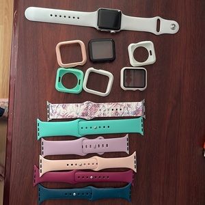 Apple Watch series 3 38mm with 6 silicone bands and 6 screen bummers